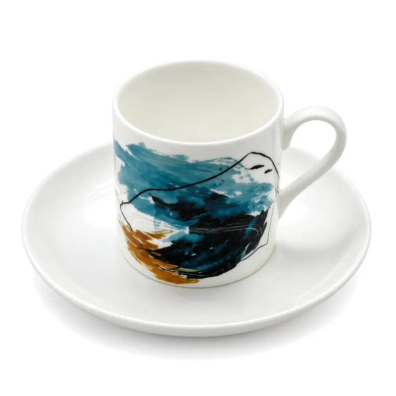 Abstract teal ceramic cup and saucer